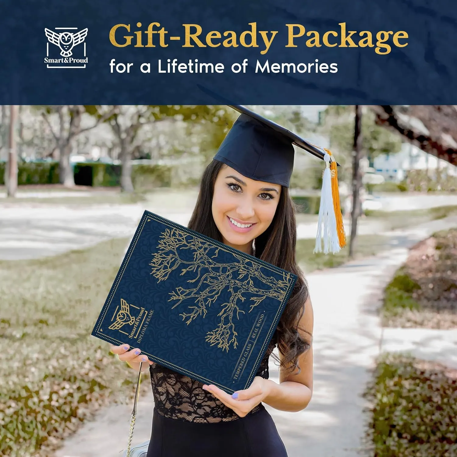 A graduate holding a Smart & Proud gift box